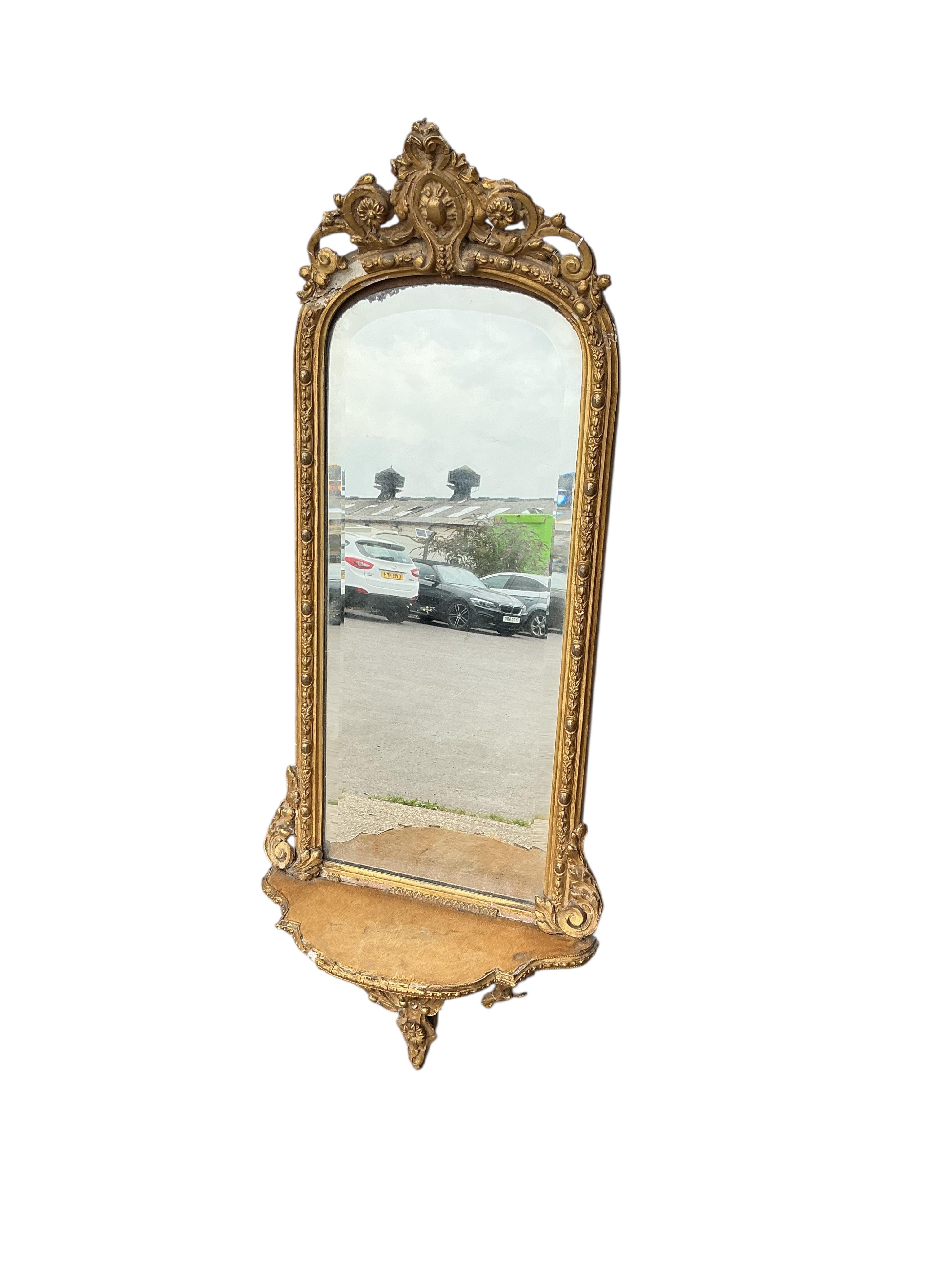A Victorian giltwood and composition wall mirror, width 38cm, height 96cm, some damage